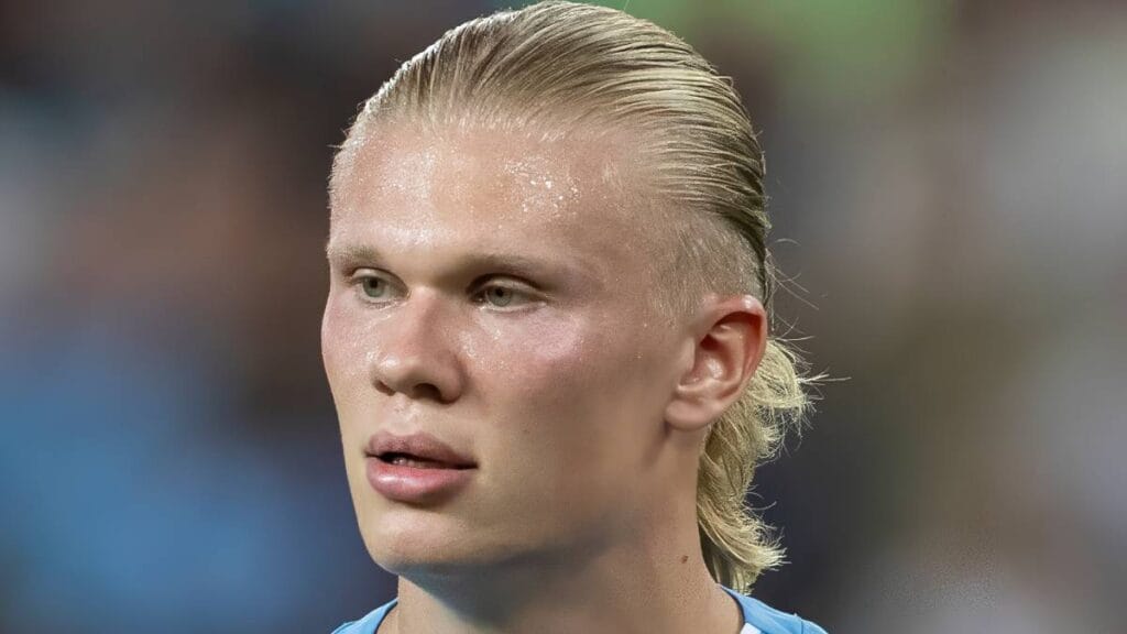 Footballer Erling Haaland playing football for Man City