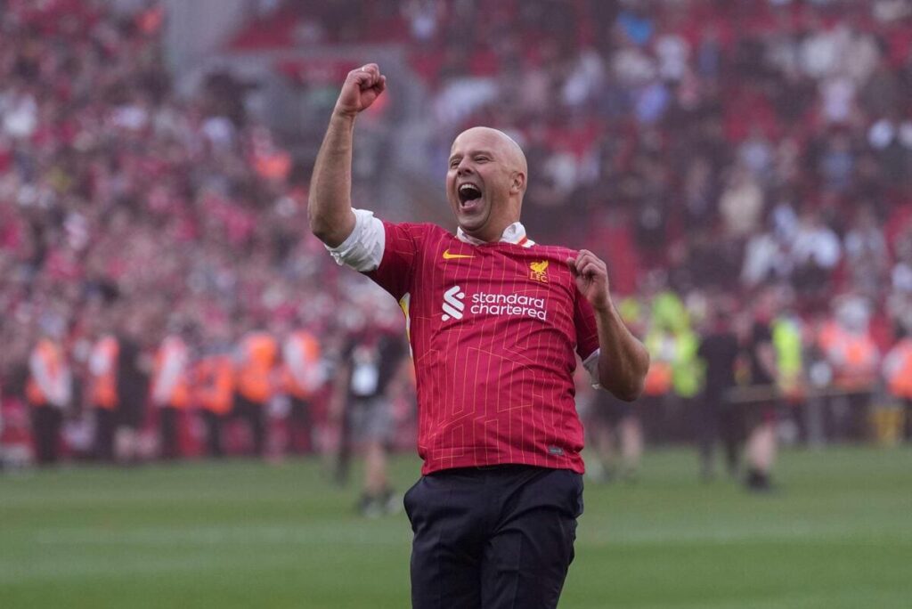 Arne Slot celebrates Liverpool winning the league