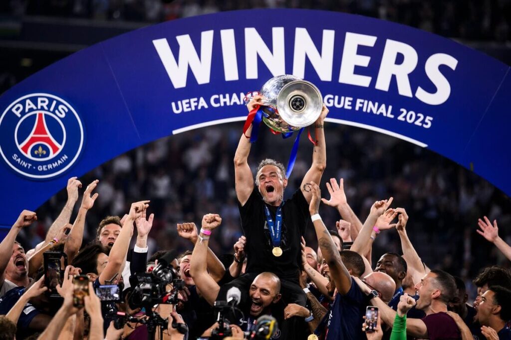 Paris Saint-Germain boss Luis Enrique lifts the Champions League trophy