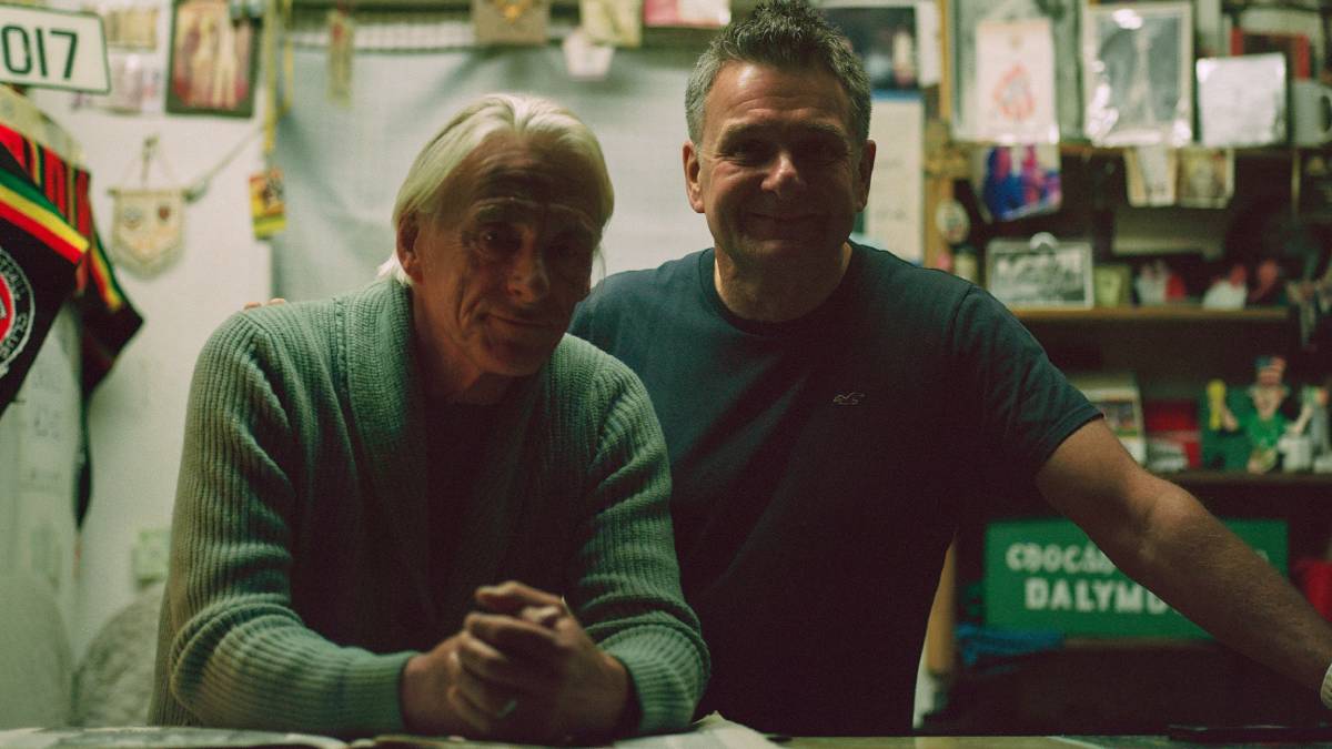 A photo of Paul Weller in Oasis Bohemians FC shirt promo material