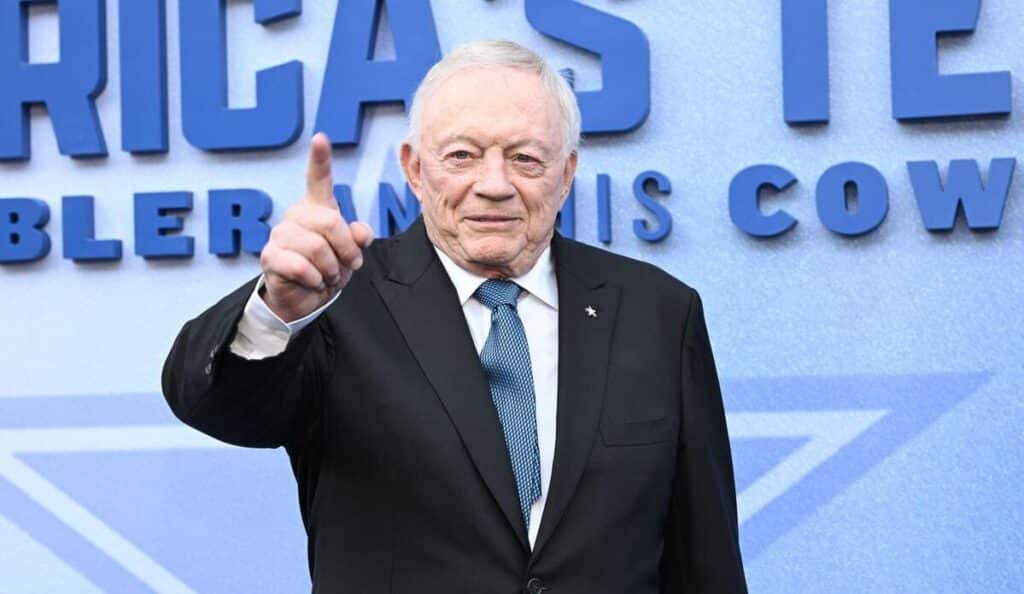 Dallas Cowboys owner Jerry Jones pointing to something out of frame.