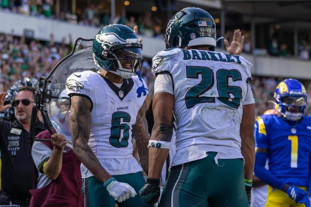 Philadelphia Eagles wide receiver DeVonta Smith and running back Saquon Barkley celebrate a touchdown.
