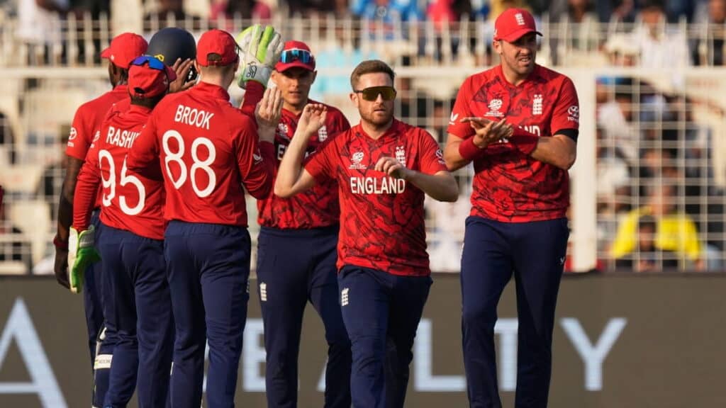 England national cricket players celebrate taking a wicket vs Scotland