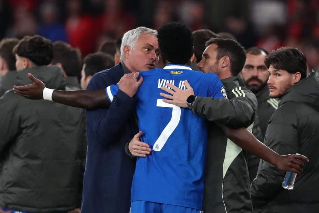 Jose Mourinho speaks to Vinicius Jr during Tuesday night's game between Benfica and Real Madrid