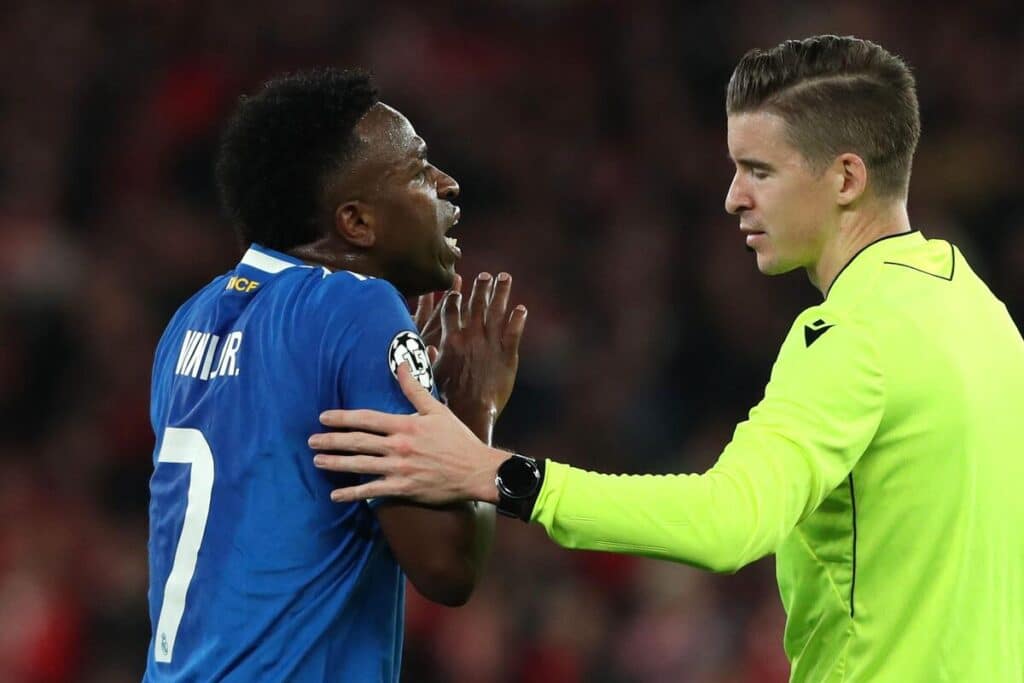 Vinicius Jr of Real Madrid tells the referee he believes he has been racially abused by Gianluca Prestianni