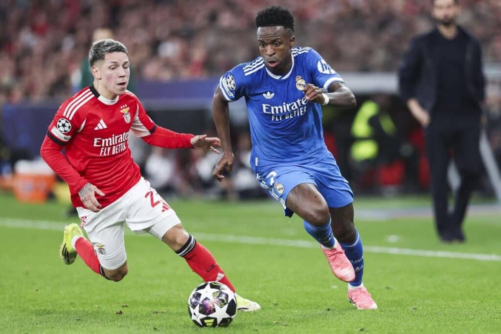Gianluca Prestianni and Vinicius Jr in actin during the first leg of the Champions League play-off between Benfica and Real Madrid