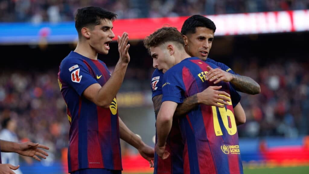 Barcelona players celebrate scoring against Levante
