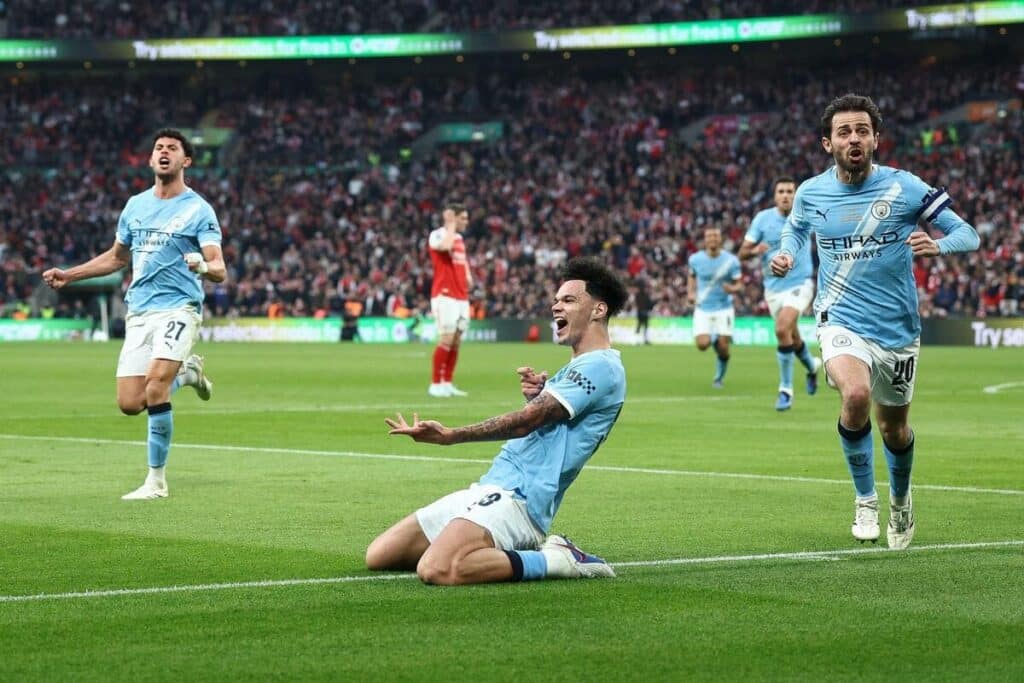 Manchester City's Nico O'Reilly celebrates scoring in the EFL Cup final.