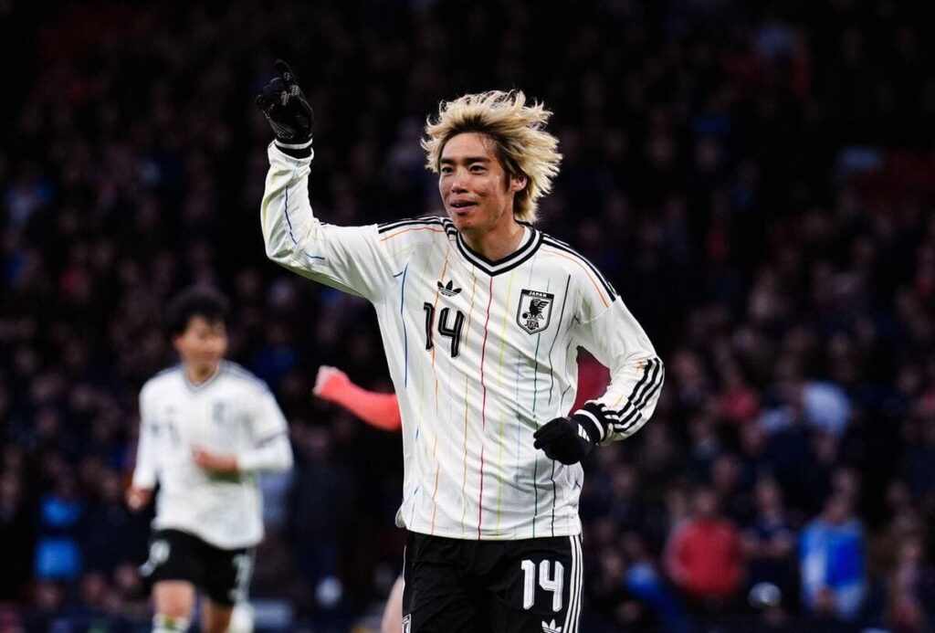 Junya Ito of Japan celebrates scoring against Scotland.