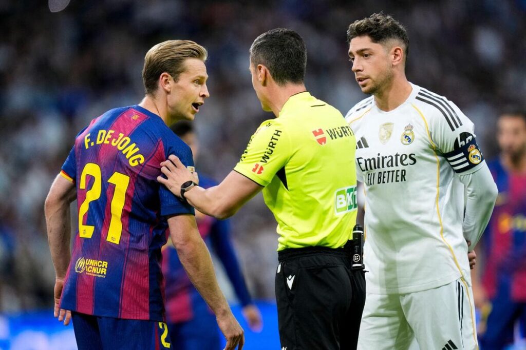 Barcelona's Frenkie de Jong and Federico Valverde of Real Madrid